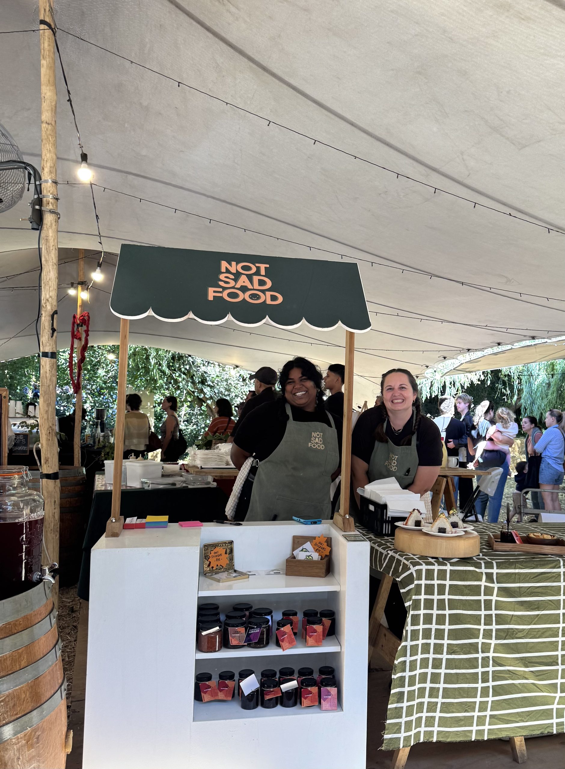A food trader and market moment at Kindred Market